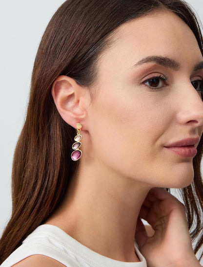 Oval dangling earrings with figures